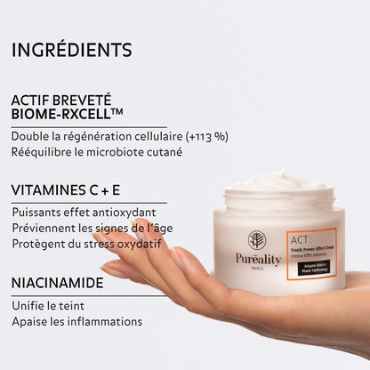 Image promotionnelle d’un soin visage : un pot de crème « Puréality - Crème Eclat Régénérante » posé sur une main. À gauche, texte listant les ingrédients et leurs bénéfices : actif breveté BIOME-RXCELL™ (double la régénération cellulaire +113 %, rééquilibre le microbiote cutané), vitamines C + E (antioxydantes, préviennent les signes de l’âge, protègent du stress oxydatif) et niacinamide (unifie le teint, apaise les inflammations).