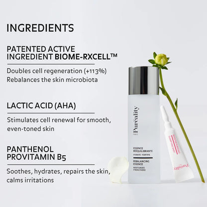 Promotional image of a Puréality rebalancing essence bottle with a booster tube and flower. Text highlights ingredients: patented BIOME-RXCELL™ (boosts cell regeneration and rebalances skin microbiota), lactic acid (AHA) to stimulate cell renewal for smoother, even-toned skin, and panthenol (provitamin B5) to soothe, hydrate, and repair the skin.